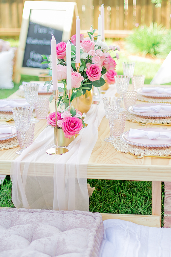 Pretty Little Picnic sign with pillows at San Clemente beach