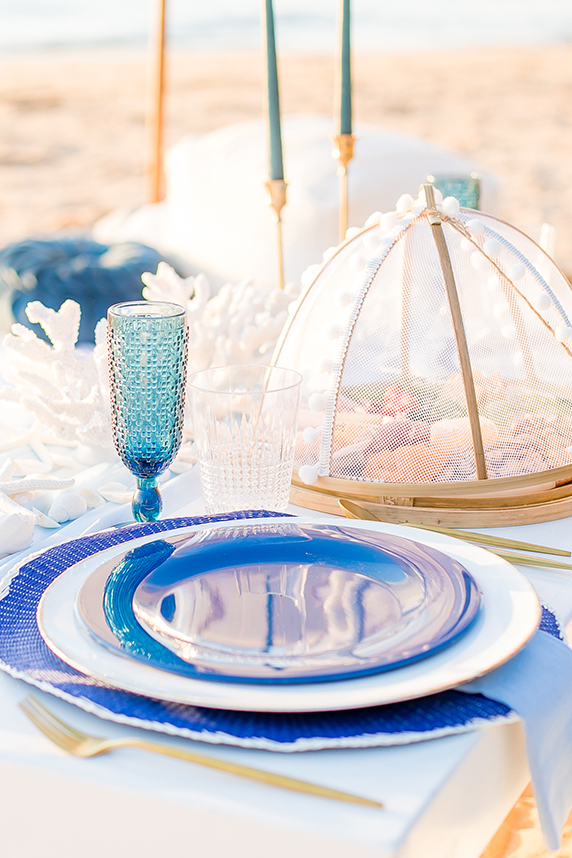 Romantic picnic under umbrella at San Clemente beach