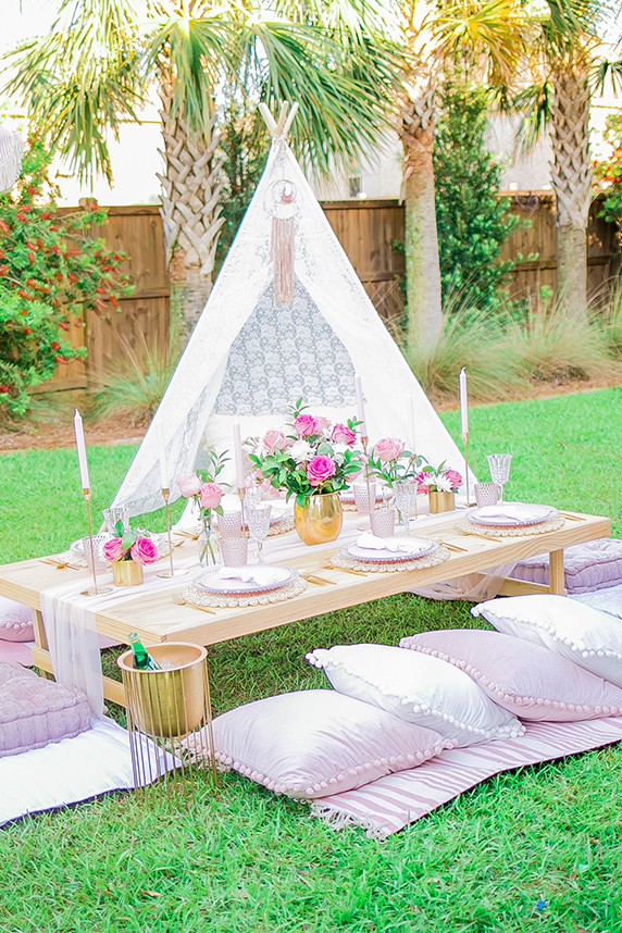 Charcuterie board on picnic table at backyard event