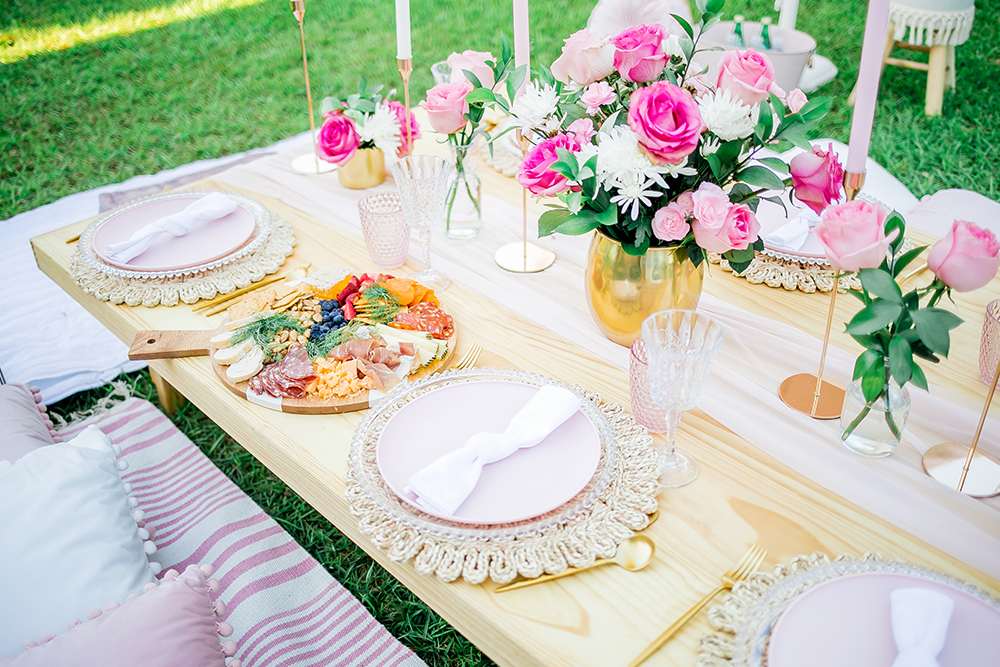 Picnic table with red and white roses at Orange County beach